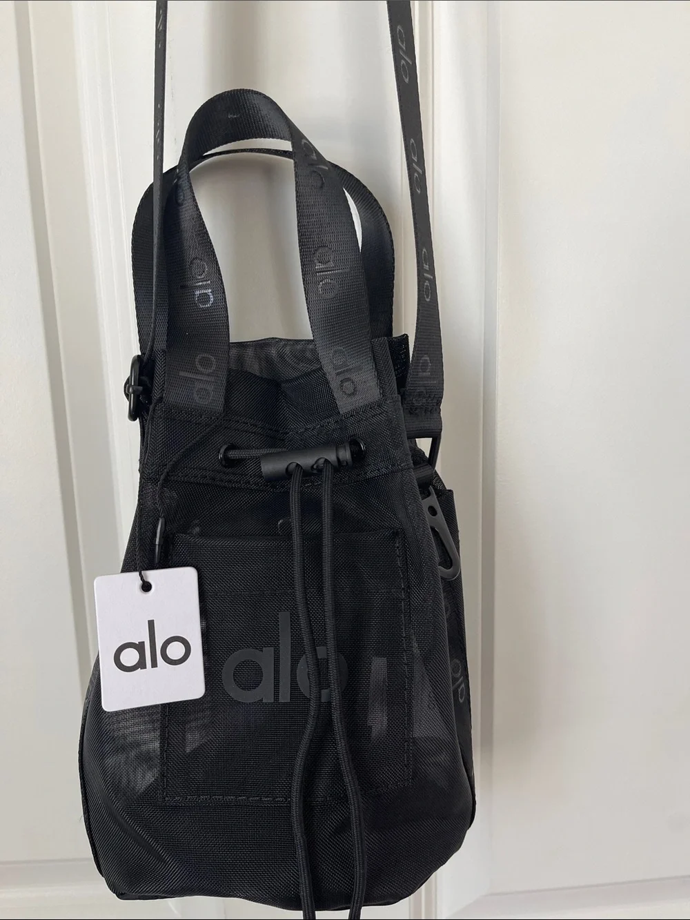 ALO Black Sheer Mesh Bucket Crossbody Bag with drawstring closure